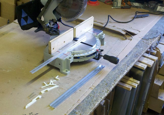 Miter saw and framing work on the bench in the Heights Hardware workshop