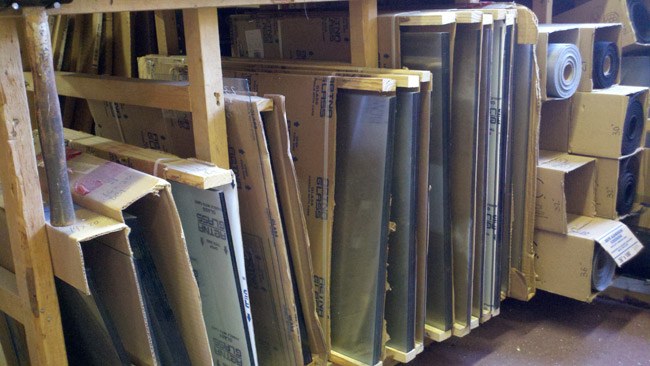 Sheets of glass and panels stored upright, ready to cut to size