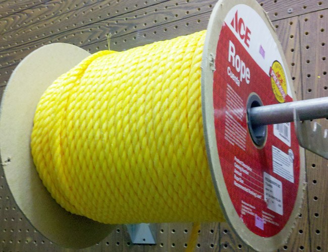 Large spool of yellow Ace rope in the store