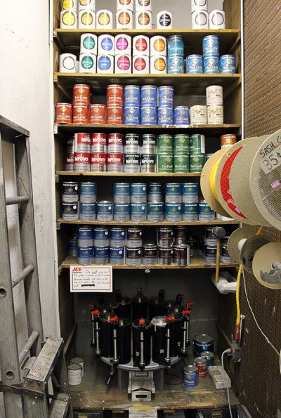 Shelves of spray paint cans in many colors inside Heights Hardware
