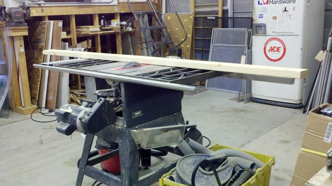 Table saw set up for cutting wood in the Heights Hardware workshop